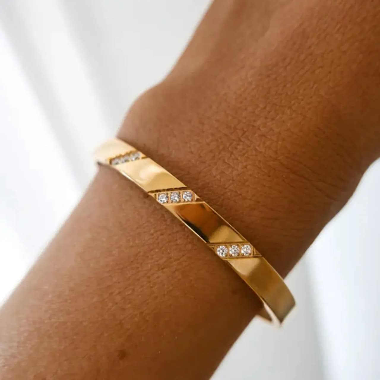 Sleek Gold-Plated Bracelet with Diamond Cut Accents