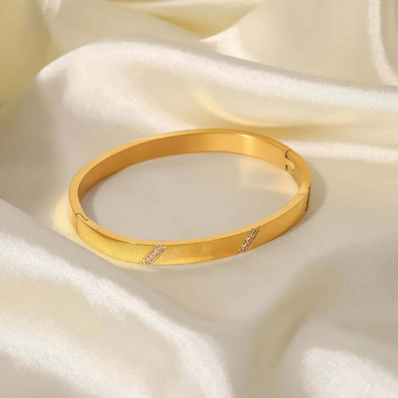 Sleek Gold-Plated Bracelet with Diamond Cut Accents